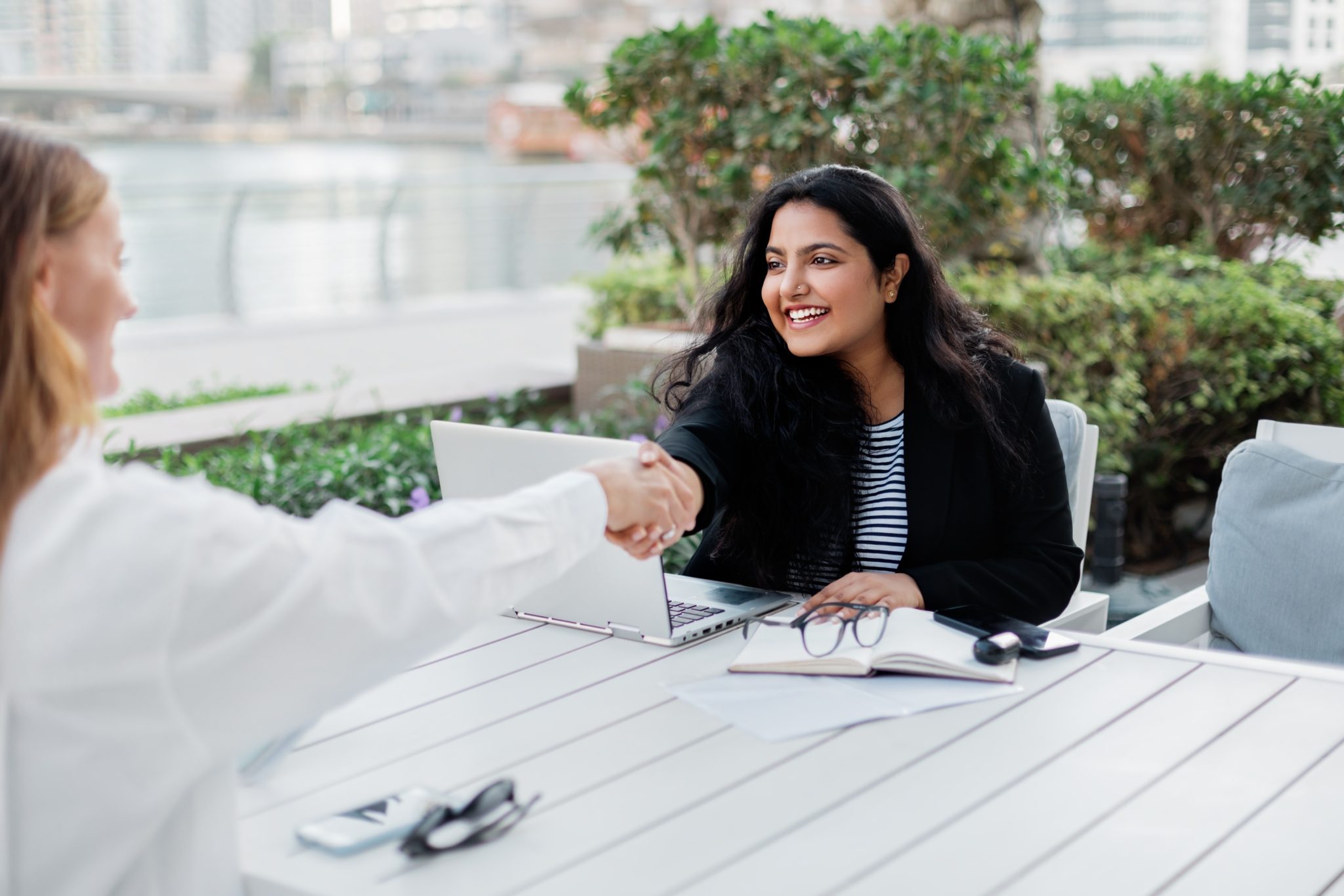 Two businesswomen make a deal during a meeting in 2023 11 27 04 57 32 utc